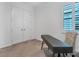 Cozy bedroom with gray carpet, a window with shutters, and a dark colored study desk at 724 Winterside Dr, Apollo Beach, FL 33572