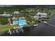 An aerial view showcases the community pool, club house, docks and lakefront amenities at 724 Winterside Dr, Apollo Beach, FL 33572