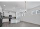 Open-concept kitchen features sleek stainless steel appliances and stylish gray backsplash at 724 Winterside Dr, Apollo Beach, FL 33572