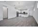 Open floor plan combines a sleek kitchen, dining space, and living area with modern finishes and plenty of natural light at 724 Winterside Dr, Apollo Beach, FL 33572