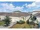 Aerial shot of rear exterior shows the property, lush lawn, and neighboring homes at 724 Winterside Dr, Apollo Beach, FL 33572