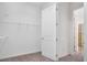 Walk-in closet with wire shelving providing ample storage space and access to bathroom at 724 Winterside Dr, Apollo Beach, FL 33572