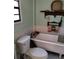 Charming bathroom features a classic clawfoot tub and light green painted walls at 7608 Chenkin, Zephyrhills, FL 33540