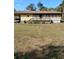 Charming single-story home with wooden porch and carport set in a spacious yard at 7608 Chenkin, Zephyrhills, FL 33540