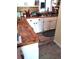 Bright kitchen featuring custom butcher block countertops and stainless steel appliances at 7608 Chenkin, Zephyrhills, FL 33540