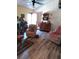 Cozy living room features wood-look floors, recliner seating and unique decorative elements at 7608 Chenkin, Zephyrhills, FL 33540
