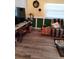Comfortable living room with wood-look floors and cozy seating at 7608 Chenkin, Zephyrhills, FL 33540