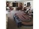 Eclectic living room boasts a dog, a unique round table, and decor at 7608 Chenkin, Zephyrhills, FL 33540
