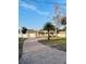 Charming home with a brick driveway, well-maintained lawn, and lush landscaping at 8139 38Th N Ave, St Petersburg, FL 33710