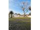 Charming single-story home with a well-manicured front lawn, mature trees, and inviting curb appeal at 8139 38Th N Ave, St Petersburg, FL 33710