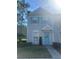Charming two-story townhome with light blue shutters and an inviting front entrance at 8541 Hunters Key Cir, Tampa, FL 33647