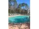 Community pool with lounge chairs, and landscaped surroundings at 8541 Hunters Key Cir, Tampa, FL 33647
