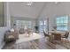 Inviting living room featuring neutral tones, modern furnishings, and a sliding glass door to the patio at 9204 Lake Chase Island Way # 9204, Tampa, FL 33626