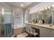 Well-lit bathroom with a large tub and walk-in shower at 9233 Souchak Dr, Trinity, FL 34655