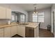 An airy kitchen space looks into the dining and lanai area at 9233 Souchak Dr, Trinity, FL 34655