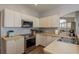 Bright kitchen features modern stainless steel appliances and ample counter space at 9233 Souchak Dr, Trinity, FL 34655