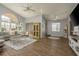 Spacious living room with vaulted ceilings, wood floors, and abundant natural light at 9233 Souchak Dr, Trinity, FL 34655