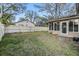 Spacious backyard features a well-maintained lawn and a fenced perimeter for privacy at 9318 Heritage Oak Ct, Tampa, FL 33647
