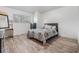 Bedroom with wood flooring, and a window at 9318 Heritage Oak Ct, Tampa, FL 33647