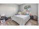 Cozy bedroom with a large window and wood flooring at 9318 Heritage Oak Ct, Tampa, FL 33647