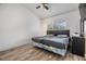 Bedroom with wood flooring, window, and closet at 9318 Heritage Oak Ct, Tampa, FL 33647