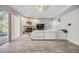 Bright living room featuring a fireplace, modern flooring, and a large sliding glass door to the pool area at 9318 Heritage Oak Ct, Tampa, FL 33647
