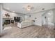Spacious living room with fireplace, modern flooring, and a comfortable white sectional sofa at 9318 Heritage Oak Ct, Tampa, FL 33647