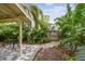 Tropical backyard with covered patio and stone pavers at 1045 6Th N St, St Petersburg, FL 33701