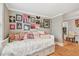 Cozy bedroom features hardwood floors, a daybed, and unique wall art for personality at 1045 6Th N St, St Petersburg, FL 33701