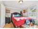 Bright bedroom featuring a queen bed, decor and a window at 1045 6Th N St, St Petersburg, FL 33701