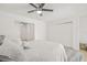 Bright bedroom features a ceiling fan, wood floors, and multiple closets at 10925 124Th Ave, Largo, FL 33778