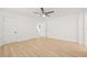 Spacious bright bedroom features wood floors, a ceiling fan, and a double door closet at 10925 124Th Ave, Largo, FL 33778