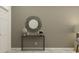 Foyer area featuring modern console table decor with a round mirror at 11251 E 65Th Ter, Palmetto, FL 34221