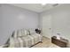 Well-lit bedroom features a daybed, and a storage ottoman at 12018 Gillingham Harbor Ln, Gibsonton, FL 33534