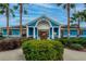 Community clubhouse showcasing a blue and white exterior with well-maintained landscaping at 12018 Gillingham Harbor Ln, Gibsonton, FL 33534