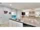 Modern kitchen island with double sinks and plenty of counter space for meal prep at 12018 Gillingham Harbor Ln, Gibsonton, FL 33534