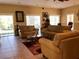 Bright living room featuring comfortable seating, large windows, and warm neutral tones at 1353 Mission Cir, Clearwater, FL 33759