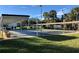 Community shuffleboard courts with shade, seating and lush green surroundings at 1353 Mission Cir, Clearwater, FL 33759