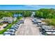 Aerial view of RV park with lake and tree views at 1487 Dundee Dr, Palm Harbor, FL 34684