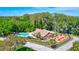 Aerial view of community pool, recreation area and the surrounding green space at 1487 Dundee Dr, Palm Harbor, FL 34684