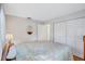 Spacious bedroom with closet, light walls, and neutral bedspread at 1487 Dundee Dr, Palm Harbor, FL 34684