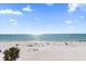 Expansive beach view with white sand and people enjoying a sunny day at 17200 Gulf Blvd # 302, North Redington Beach, FL 33708