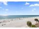 Stunning beach view features white sand, blue water, and distant boats at 17200 Gulf Blvd # 302, North Redington Beach, FL 33708