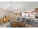 Dining area with a glass table and stylish chairs near the kitchen at 17200 Gulf Blvd # 302, North Redington Beach, FL 33708