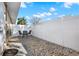 Private backyard with gravel, seating area, and a white fence providing security at 1721 S Jefferson Ave, Clearwater, FL 33756