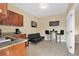 Living area with wet bar, tile flooring, black futon, and bar-style seating at 1721 S Jefferson Ave, Clearwater, FL 33756