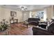 Inviting living room featuring wood flooring, bright natural light, and comfortable leather seating at 1721 S Jefferson Ave, Clearwater, FL 33756