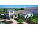 Aerial view of the community clubhouse featuring a modern architectural style and verdant landscaping at 18130 Cropside Trl, Lakewood Ranch, FL 34211