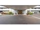 The building's covered entrance exudes curb appeal with manicured landscaping and symmetrical design at 201 W Laurel St # 909, Tampa, FL 33602