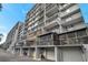 Side view of condominium balconies and garage doors, offering secure parking at 201 W Laurel St # 909, Tampa, FL 33602